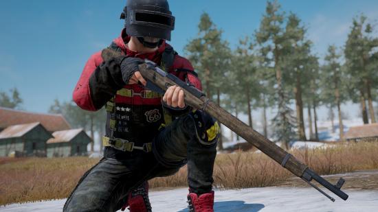 A PUBG character holding an old sniper rifle and kneeling on one knee