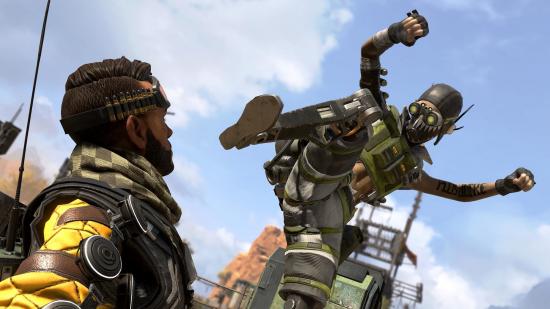 Apex Legends' Octane readies his mechincal leg to stamp on Mirage, who lies prone on the floor
