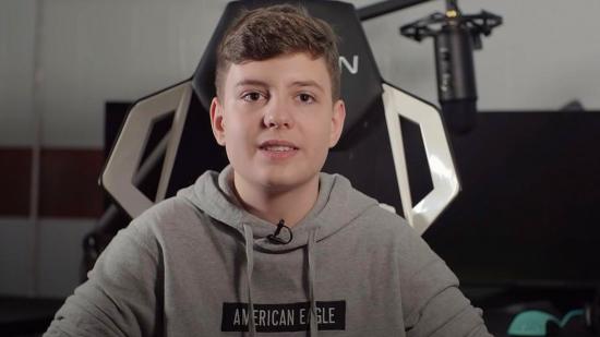 Fortnite pro Clix, sitting in a gaming chair and wearing a grey hoodie, during an interview