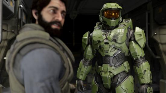 Halo Infinite: Master Chief standing next to a UNSC pilot inside a ship.