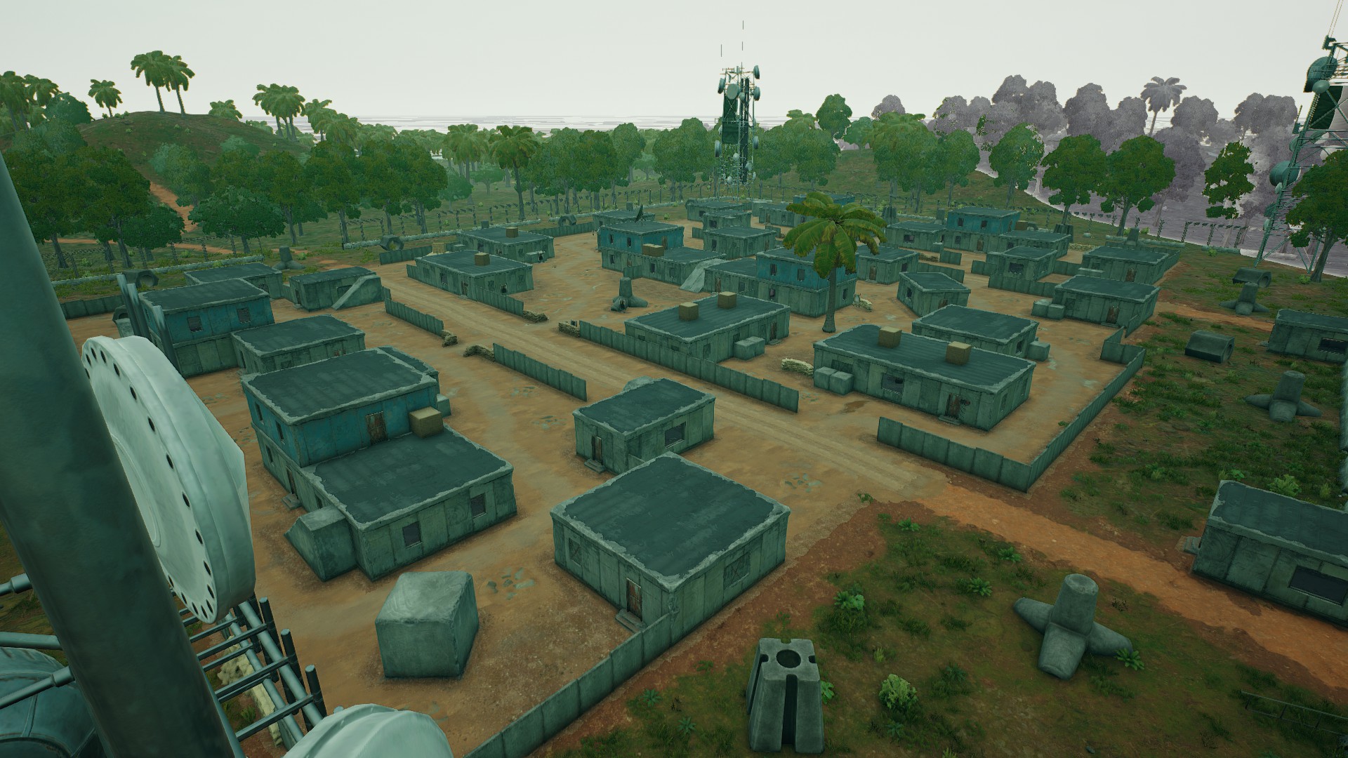 PUBG Sanhok drops: The sprawling barracks of Sanhok's Camp Alpha, surrounded by jungle trees.