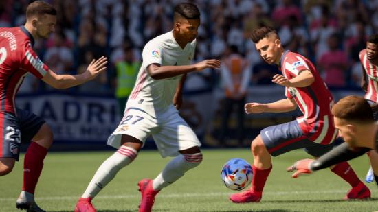FIFA 21 SBC players: Several players in a red kit trying to take the ball from a player in white.