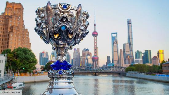 The LoL Worlds trophy with Shanghai's city skyline in the background