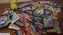 Pokémon TCG: a table covered in packs of Pokémon cards