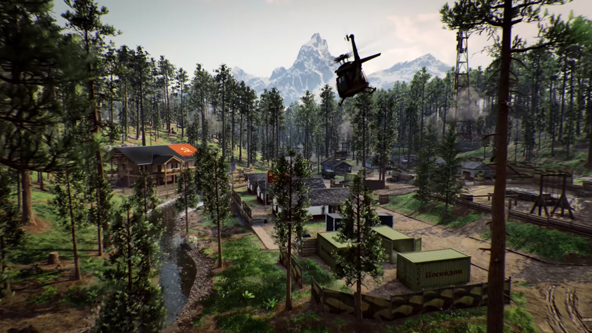 Call of Duty Black Ops Cold War multiplayer maps: A heavily forested area with a few shipping containers and buildings, with a helicopter flying overhead.