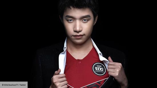 EDG Clearlove showing off his jersey underneath a suit
