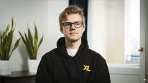 Excel's Kryze, wearing a black hoodie with a yellow XL logo