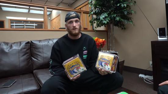 YouTuber Logan Paul holding two rare vintage Pokémon card booster boxes