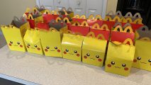 Pikachu-themed Happy Meal boxes lined up on a kitchen counter