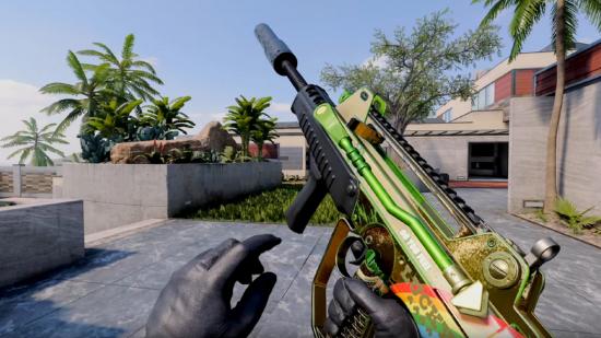 A colourful gold and green assault rifle held in front of a concrete building