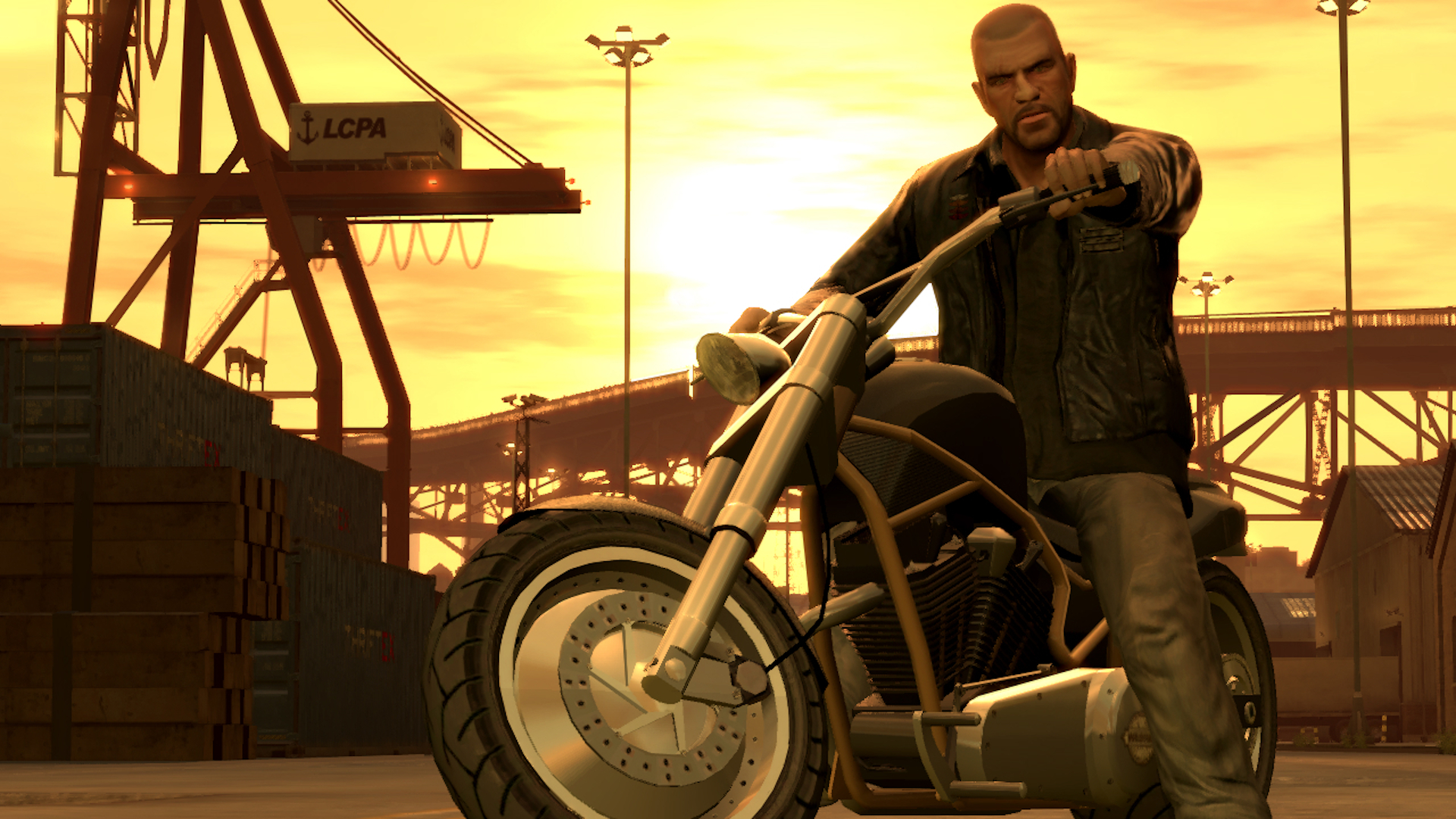 GTA 4 cheat codes: A biker staring menacingly at the camera in Liberty City at sunset.