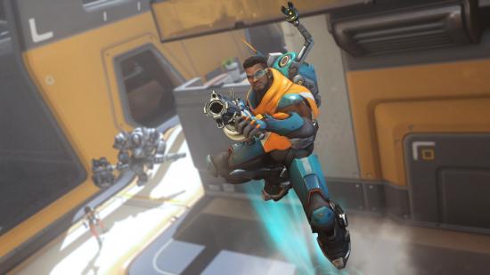 Overwatch hero Baptiste boosting upwards holding a gun and wearing a blue and orange suit of armour