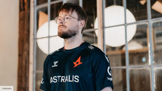 Astralis player promisq wearing a black jersey and glasses