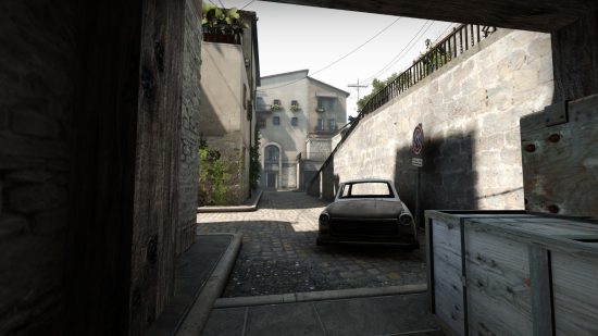 CS:GO Italy removed: Italy, shown from underneath the ramp pointing towards CT where a rusting car is left out on the cobbled streets