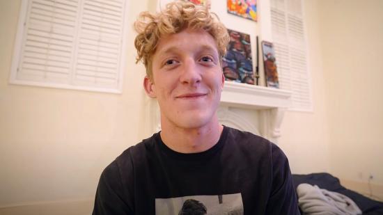 Streamer Tfue with blond curly hair, wearing a black t shirt