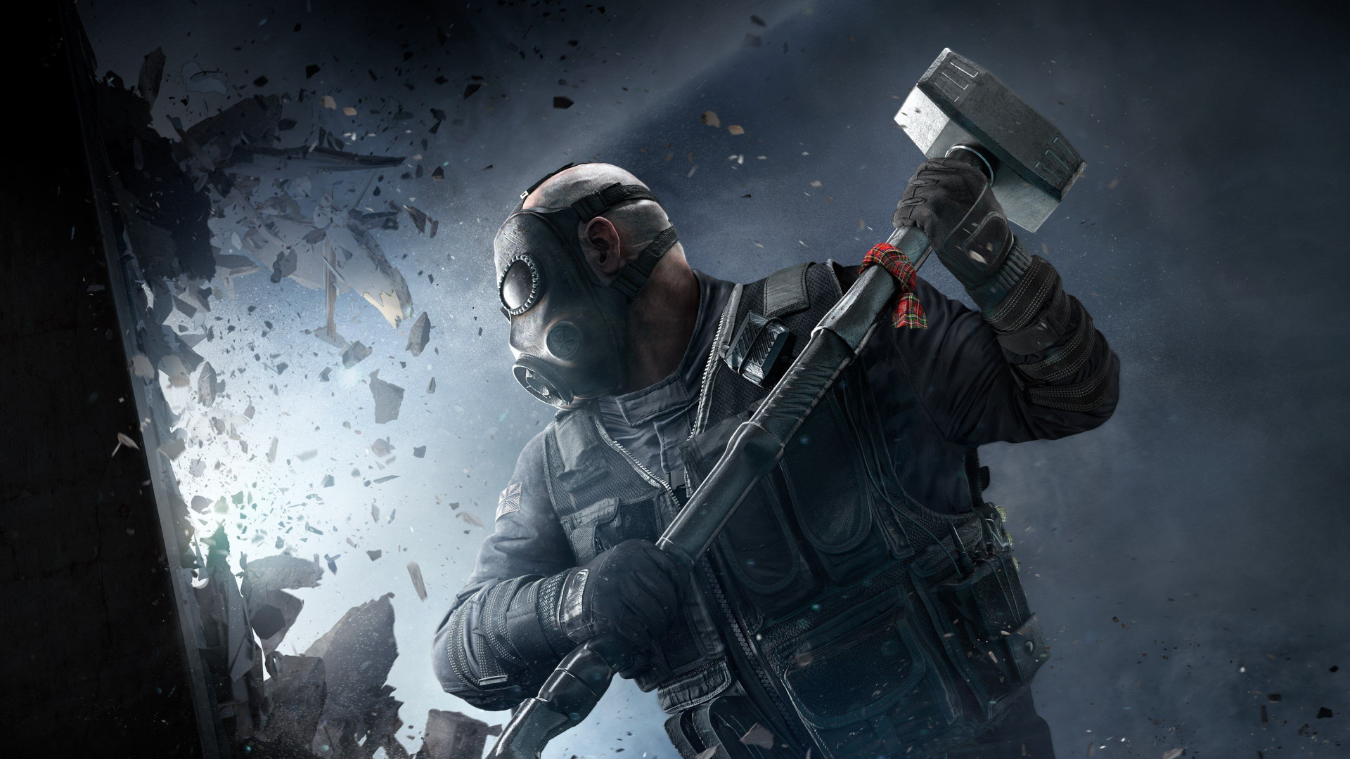 Rainbow Six Siege crossplay: A soldier with a big sledgehammer above his head smashes through a wall.