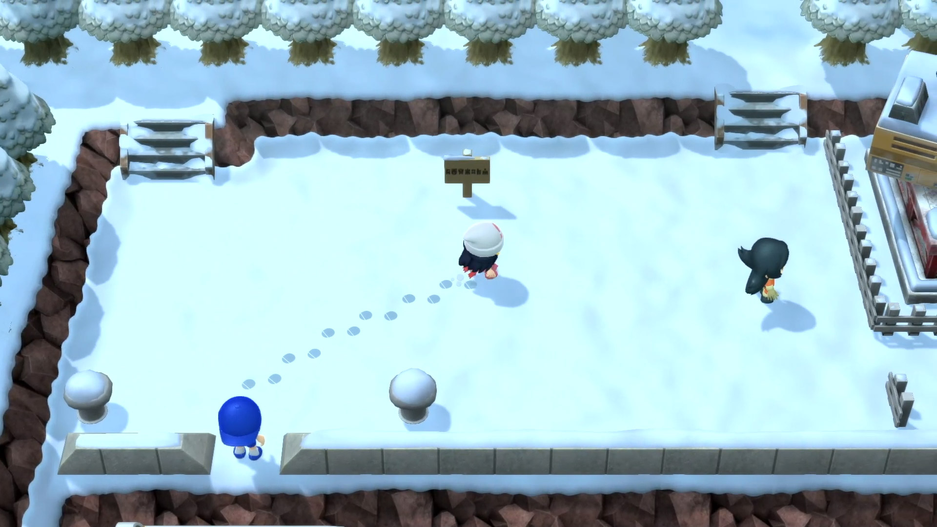 Pokémon Brilliant Diamond and Shining Pearl: A view of a character running through snow, leaving footprints behind them, as seen from above.
