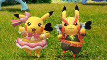 Two Pikachu in costume dance on grass