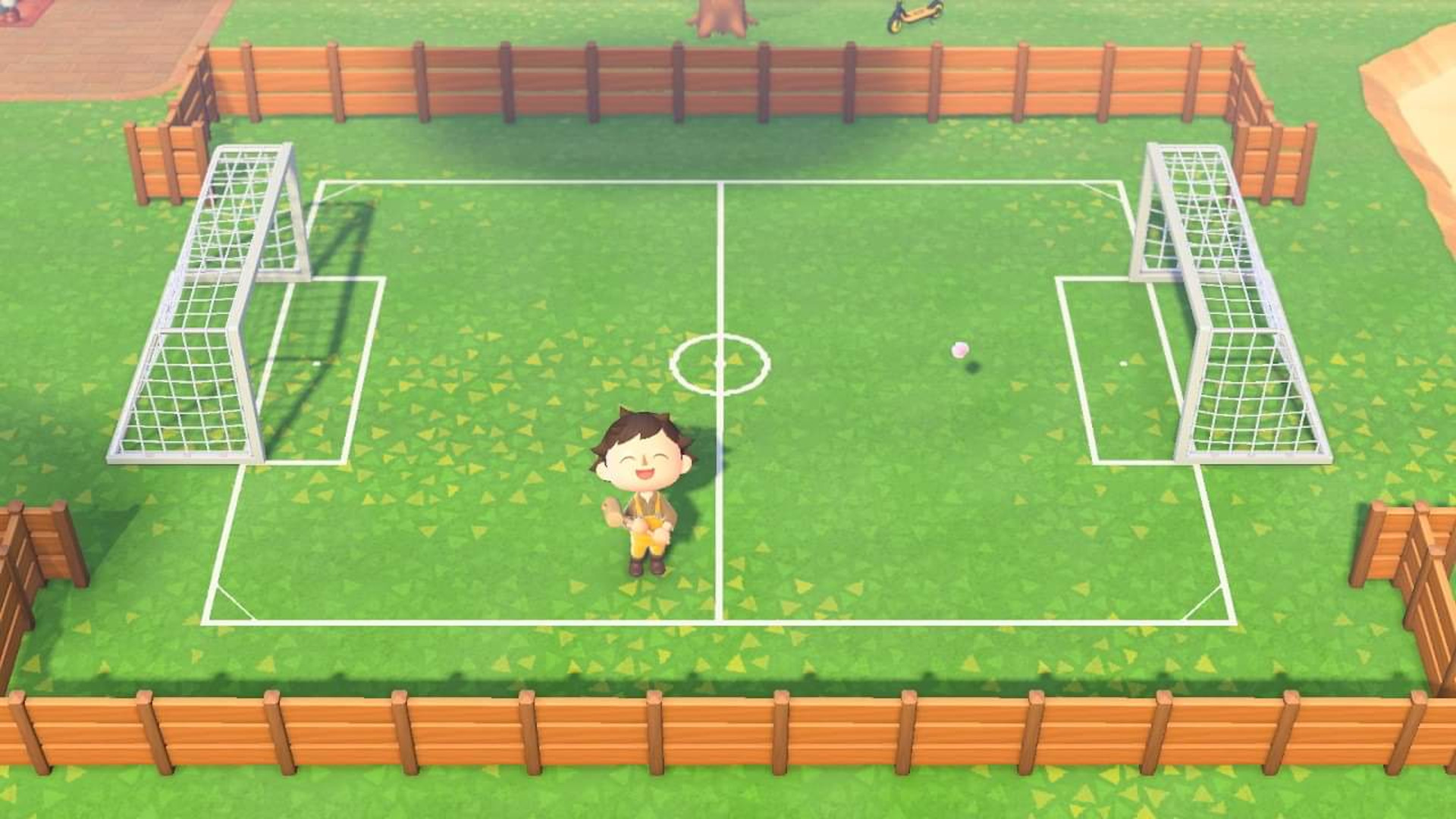 Animal Crossing New Horizons island ideas: An Animal Crossing character stood on a football pitch.