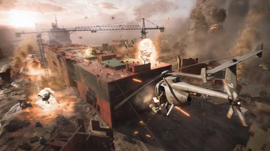 Battlefield 2042 release date: A helicopter flying towards a large cargo ship surrounded by explosions in the desert.
