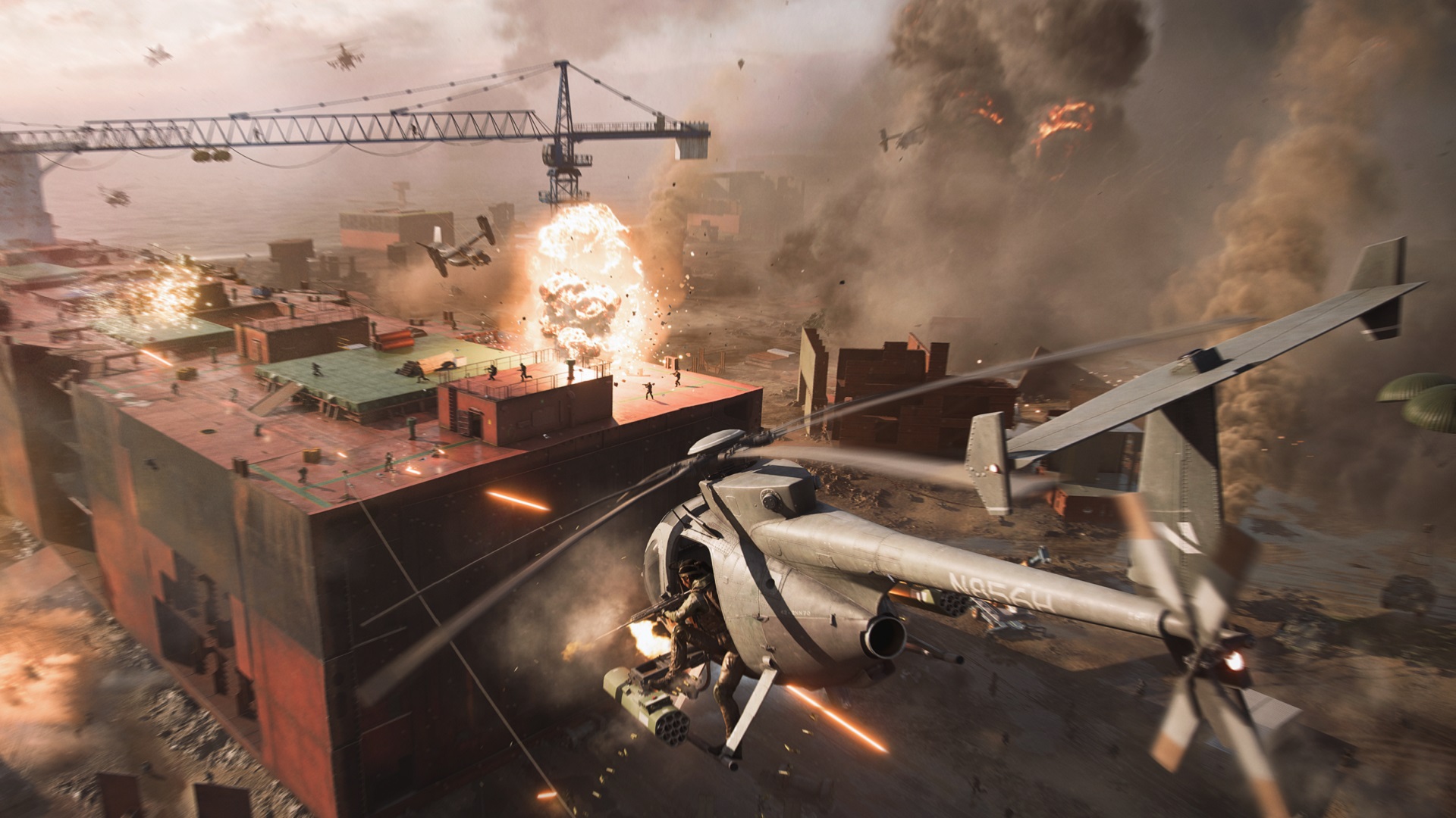 Battlefield 2042 maps: A helicopter flying towards a beached cargo ship with soldiers onboard.