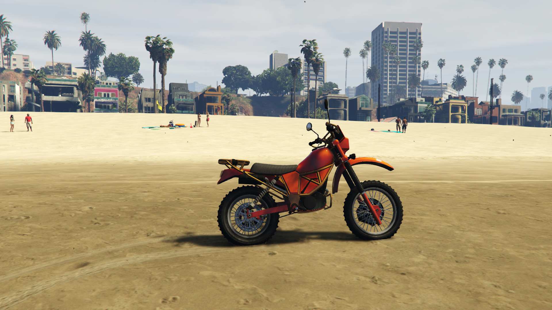 GTA Online fastest bikes: An off-road bike parked on the beach, with people relaxing in the background.
