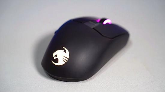 a Roccat gaming mouse in black, with a light-up logo and mouse wheel
