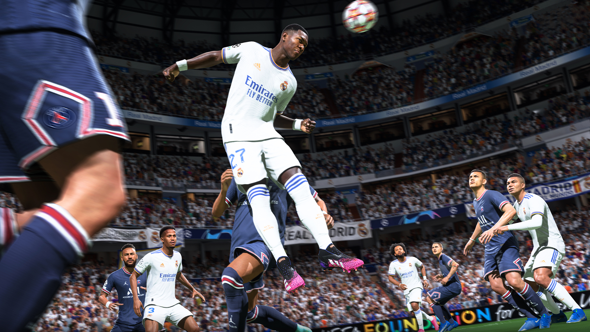 FIFA 22 release date: Alaba jumps up and heads a ball.