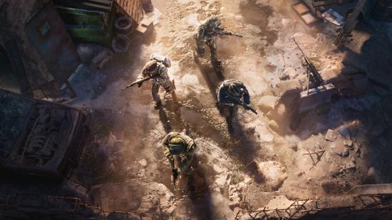 Four soldiers stealthily move through a dusty area