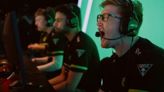 CDL pro Scump roars as OpTic Chicago win a round. He's wearing a black headset, with a black and green jersey