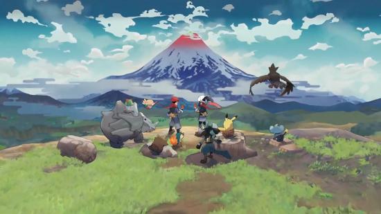 A Pokemon trainer and several Pokemon sit atop a hill gazing out at a snow-capped mountain