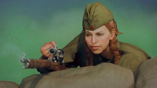 A World War 2 female sniper with ginger hair and a green military cap holds a wooden sniper rifle over a sandbag as part of a Warzone teaser for Call of Duty: Vanguard