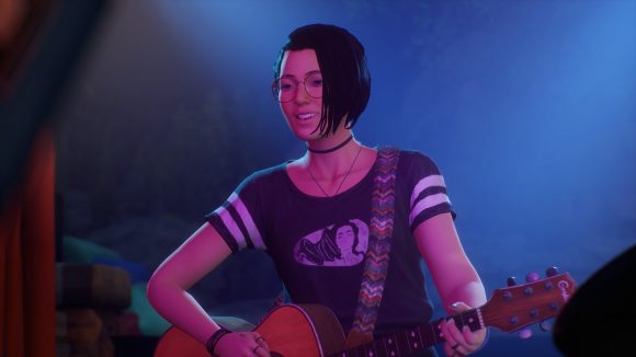 Life is Strange: True Colors' Alex in a black and white-striped t-shirt playing guitar