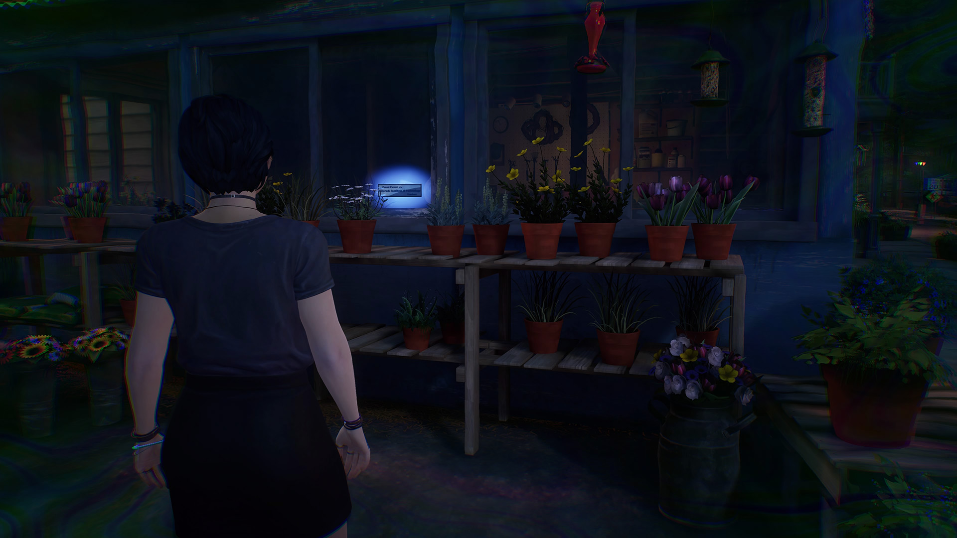 Life is Strange True Colors memory locations: Alex looking at a sticker on the glass of a greenhouse.