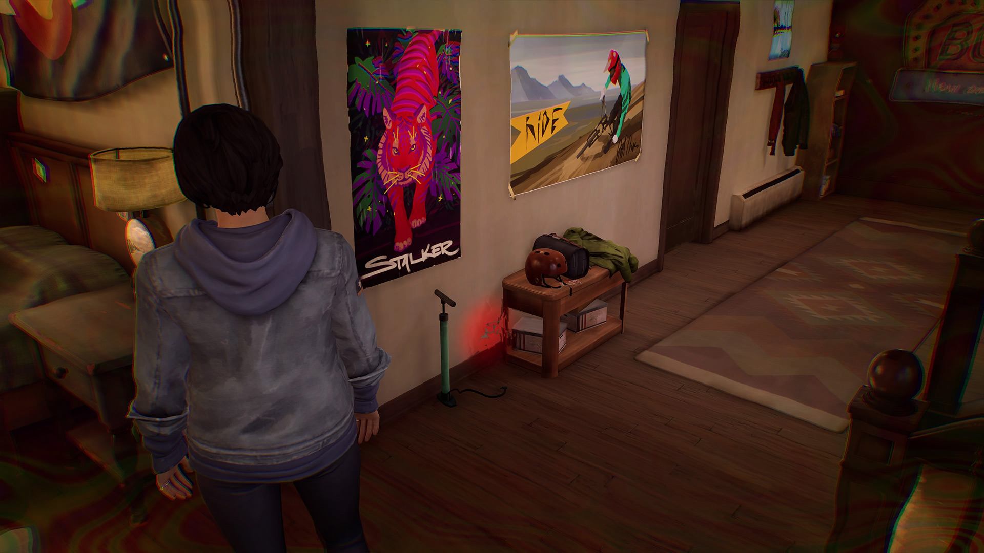 Life is Strange True Colors memory locations: Alex looking at posters on the wall, including a colorful tiger poster.