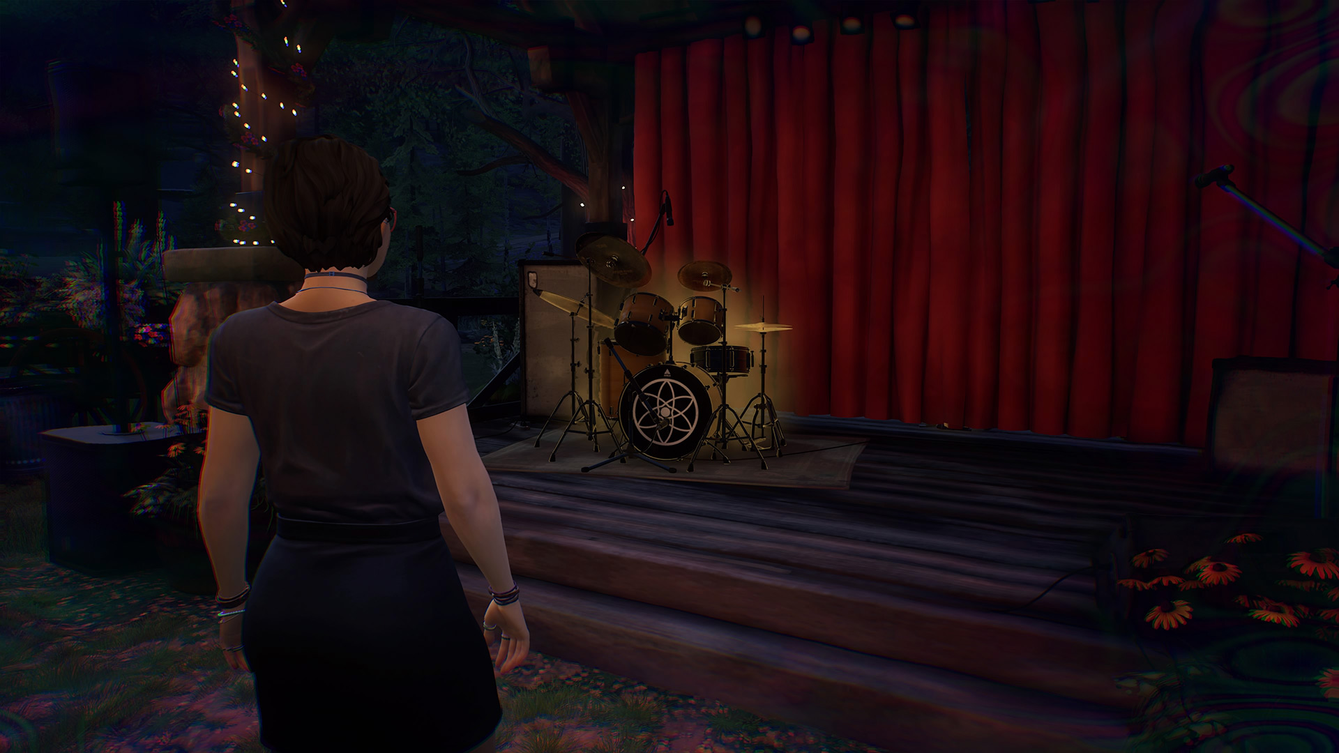 Life is Strange True Colors memory locations: Alex looking at a drumkit on a stage.