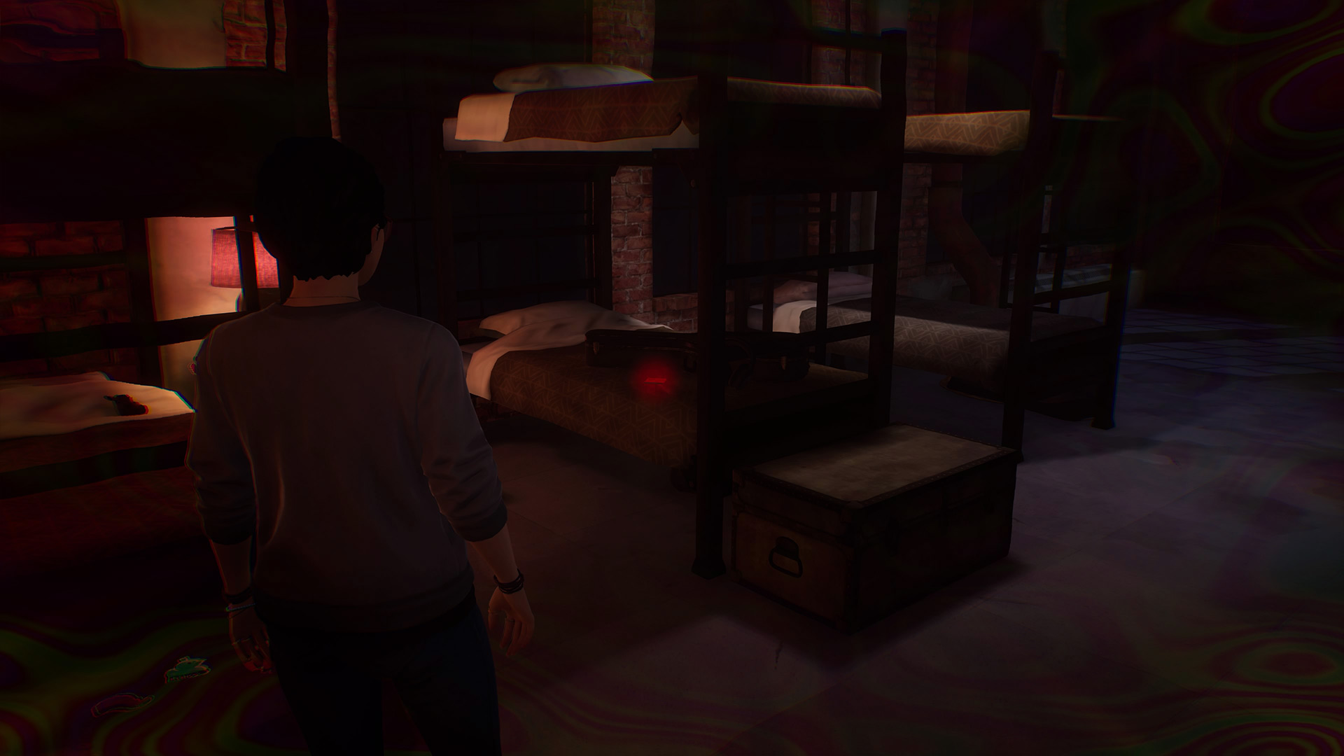 Life is Strange True Colors memory locations: Alex looking at guitar strings placed on the bottom bunkbed in a large bedroom with other beds.