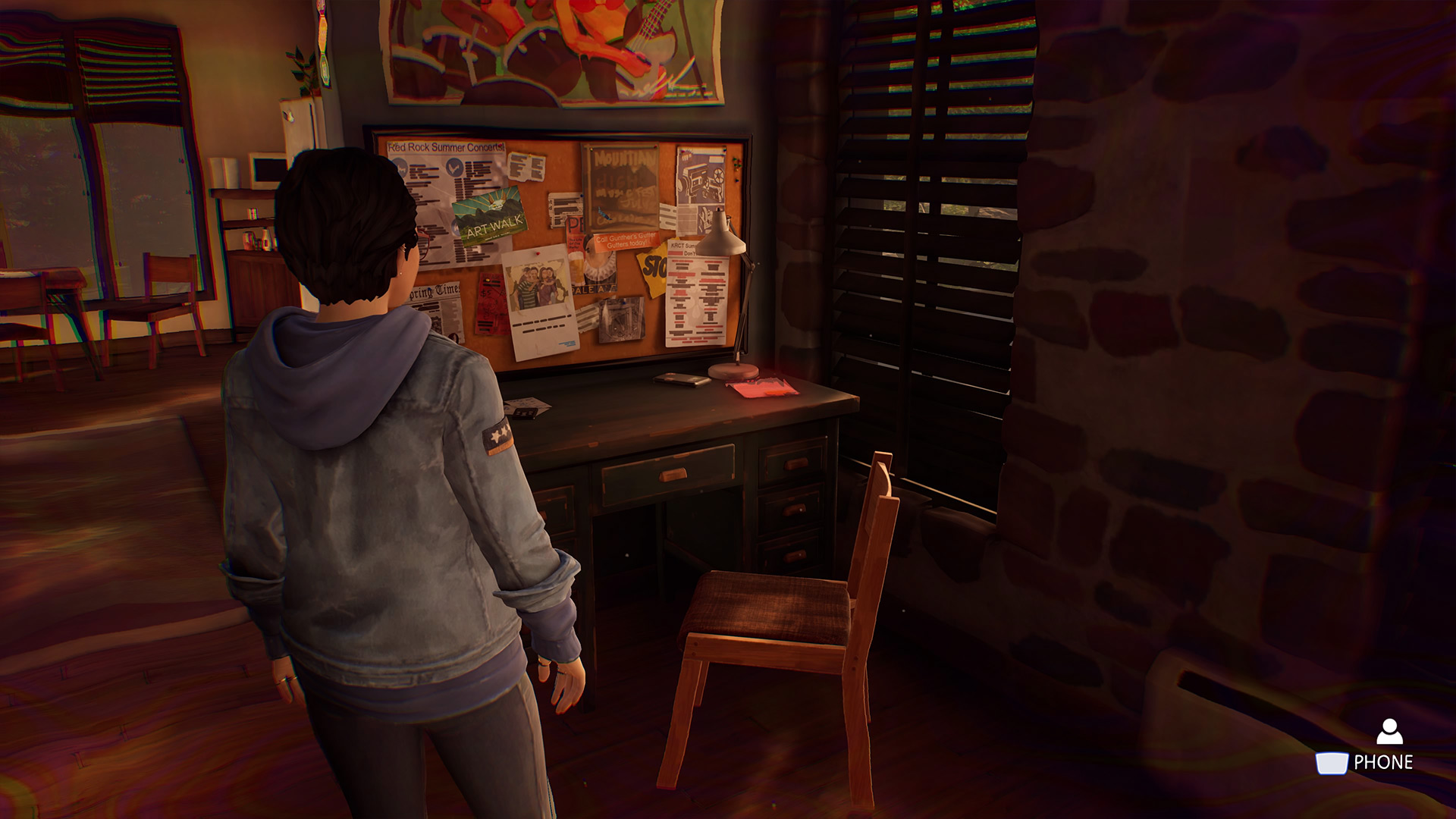 Life is Strange True Colors memory locations: Alex looking at a desk with a lamp and busy note board.