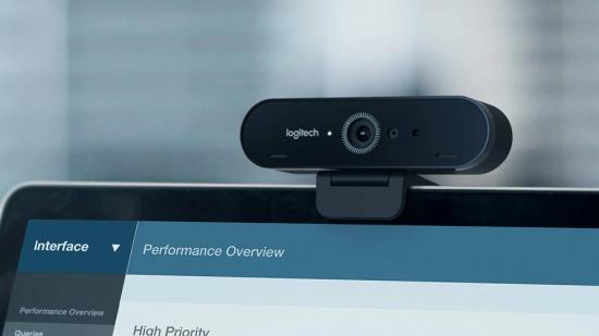 The Logitech Brio Stream webcam can be seen sitting on the top of a laptop.