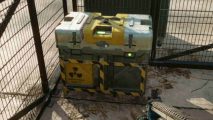 Far Cry 6 Depleted Uranium Locations: a crate of Depleted Uranium sitting behind a fence.