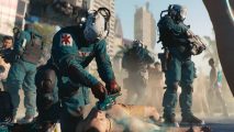 Cyberpunk 2077 update: Multiple medics stand and try to revive a man with a defiblirator.
