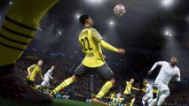 A footballer getting ready to do a header in FIFA 22, available on PlayStation 5,