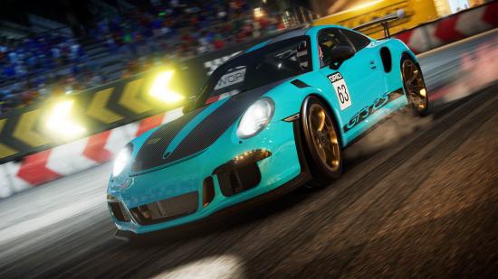 Grid Legends Microtransactions: A blue painted vehicle can be seen driving in the night on a track.