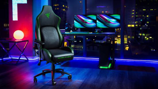 A lifestyle shot of the Razer Iskur gaming chair with a PC and two monitors in the background