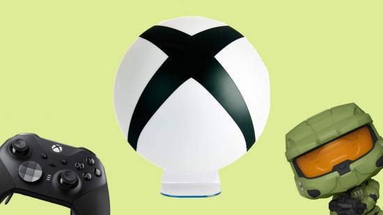 A selection of Xbox gifts: an Xbox controller and a Halo Funko Pop vinyll figure are either side of a big Xbox light.
