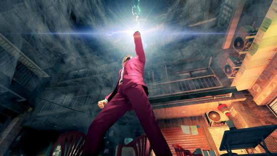 PS5 RPG games: The main character dressed in a pink suit thrusts his arm up into the air
