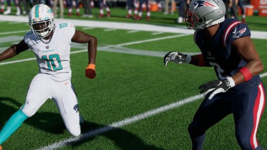 Madden 23 Game Pass: A player can be seen juking to try and dodge a person on the opposing team