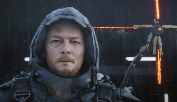 Death Stranding 2 confirmed: Sam Porter Bridges stands in the rain wearing a black hooded coat