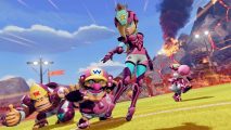Mario Strikers Battle League free trial: A team of Mario universe characters, lead by Rosalina, line up on the pitch wearing pink kits