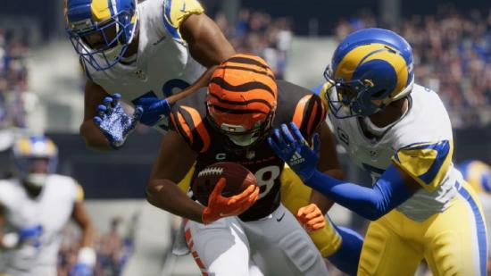 Madden 23 Release Date: Multiple players can be seen tackling another player.